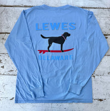 Load image into Gallery viewer, Cornflower blue long sleeve t-shirt with 'LEWES' and 'DELAWARE' text, featuring a black Labrador dog on a red surfboard, facing right.