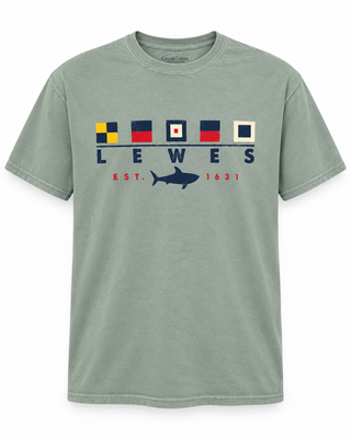 Lewes Sail Flag Shark Tee in Cactus green with five nautical signal flags, navy LEWES lettering, and a navy shark between red EST. 1631
