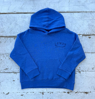 Front view of a vibrant royal blue children's pullover hoodie with an embroidered 'LEWES' logo and crossed oars on the chest, featuring a kangaroo pocket and hood, laid on a distressed white wooden surface.