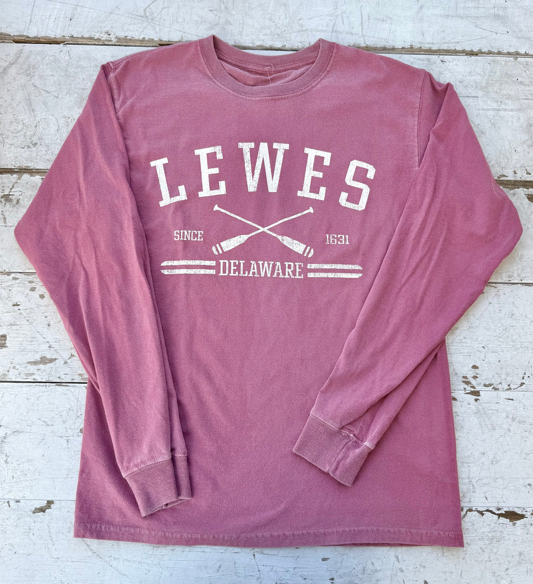 Flat lay of a washed maroon Comfort Colors long sleeve t-shirt with 