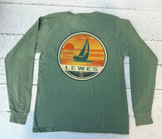 Back view of a Dorm Green long-sleeve t-shirt featuring a large circular graphic of a sailboat against an orange and yellow sunset with "LEWES DELAWARE" text and "Established 1631" with an anchor symbol.