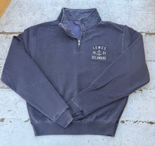 Load image into Gallery viewer, Navy quarter-zip sweatshirt with white &#39;LEWES 16 ⚓ 31 DELAWARE&#39; anchor embroidery on the chest, laid flat on a rustic white wooden background.
